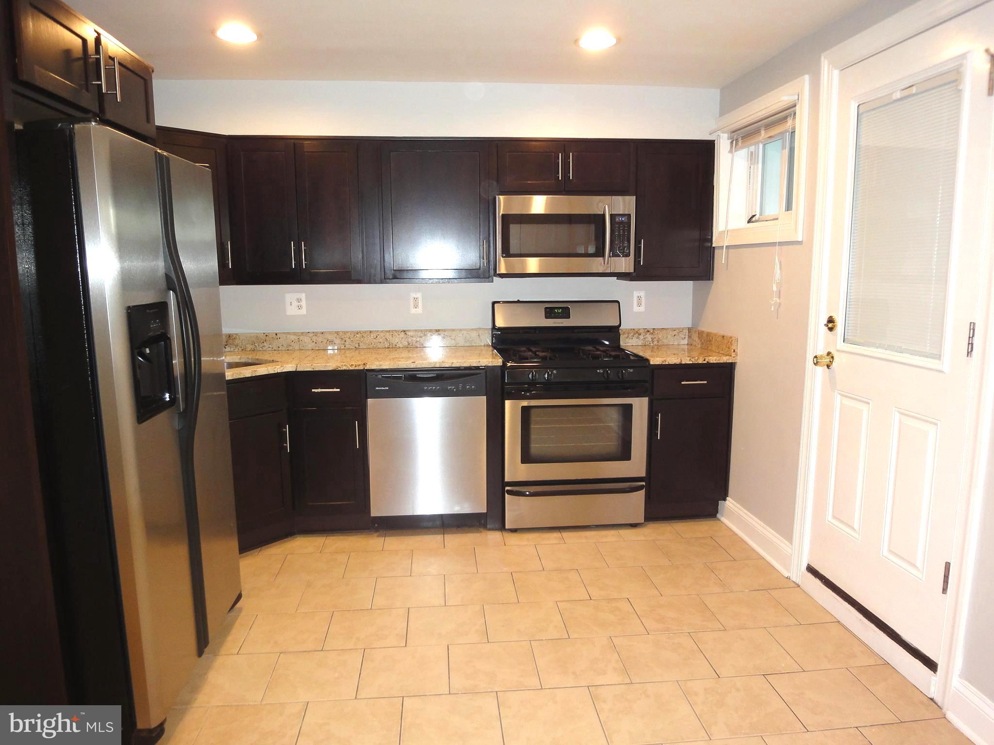 1803 Dunmere Road Baltimore, MD 21222 - Photo 7 of 14 Kitchen with tile flooring