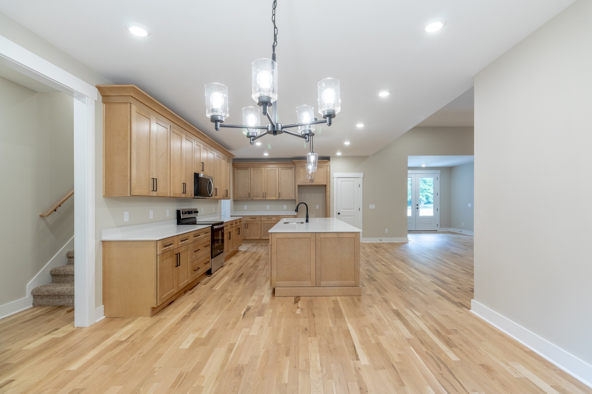 1191 Hangar Road Springfield, TN 37172 - Photo 11 of 25 a large kitchen with kitchen island lots of counter space a sink appliances and cabinets