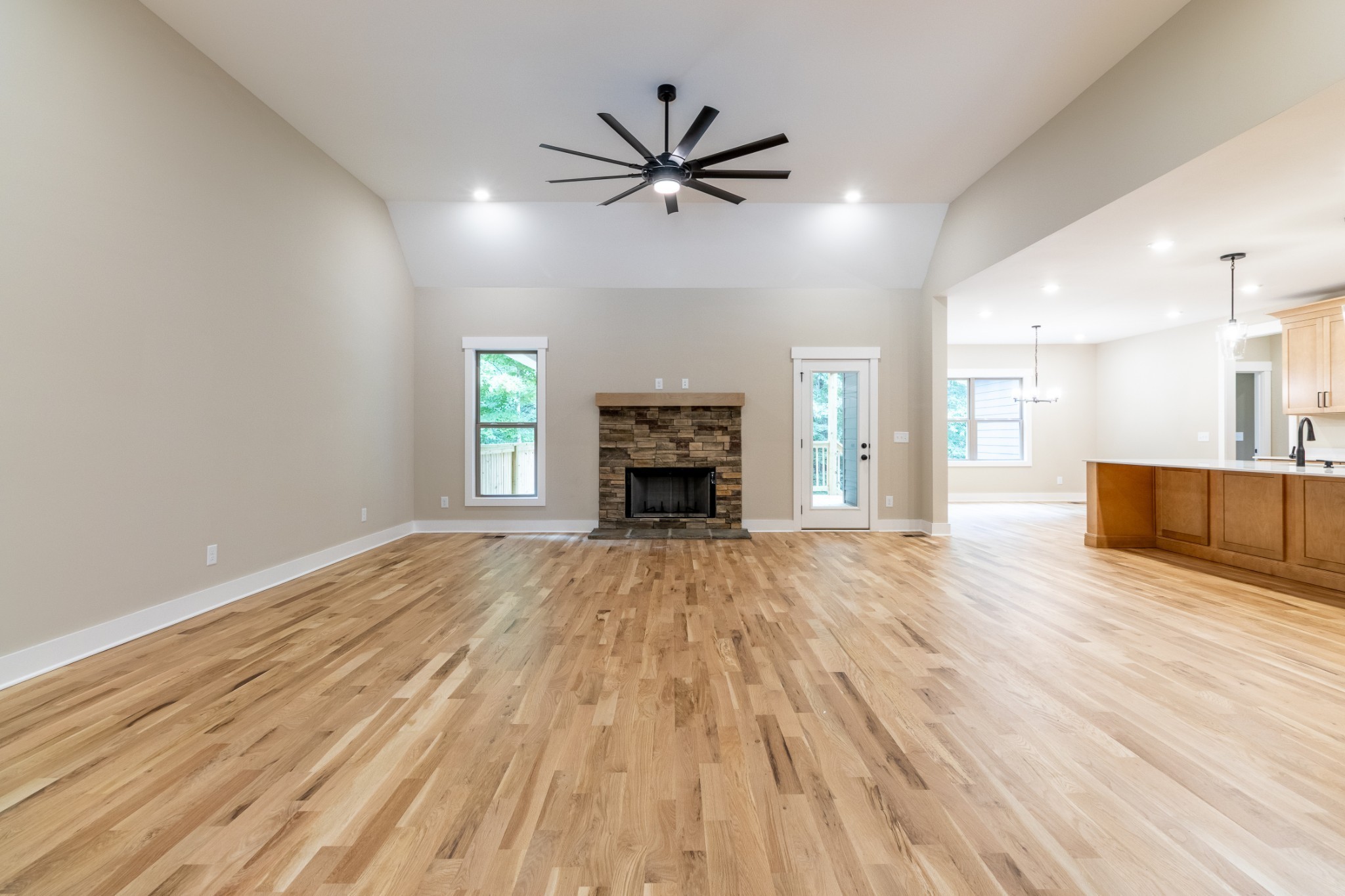 1191 Hangar Road Springfield, TN 37172 - Photo 4 of 25 wooden floor fireplace and windows in an empty room
