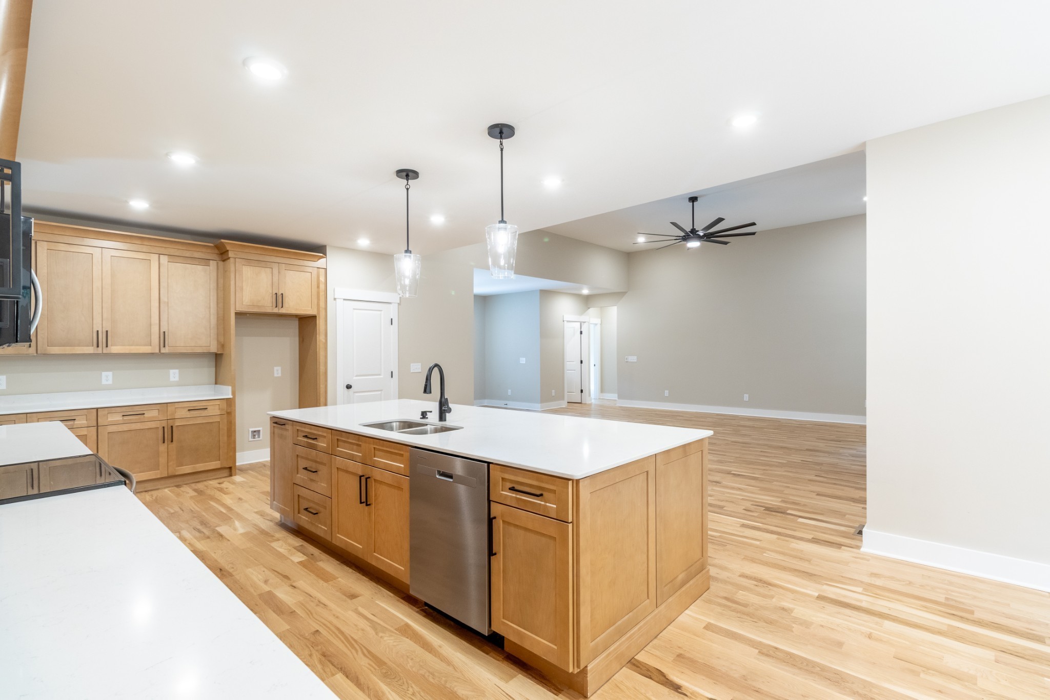 1191 Hangar Road Springfield, TN 37172 - Photo 9 of 25 a large kitchen with kitchen island a sink stainless steel appliances and cabinets