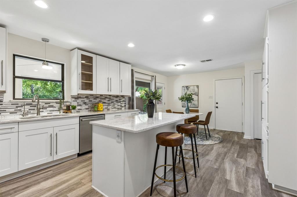 24 Legend Road Benbrook, TX 76132 - Photo 11 of 28 a kitchen with sink and view living room