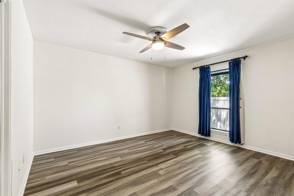 24 Legend Road Benbrook, TX 76132 - Photo 21 of 28 a view of empty room with wooden floor and fan