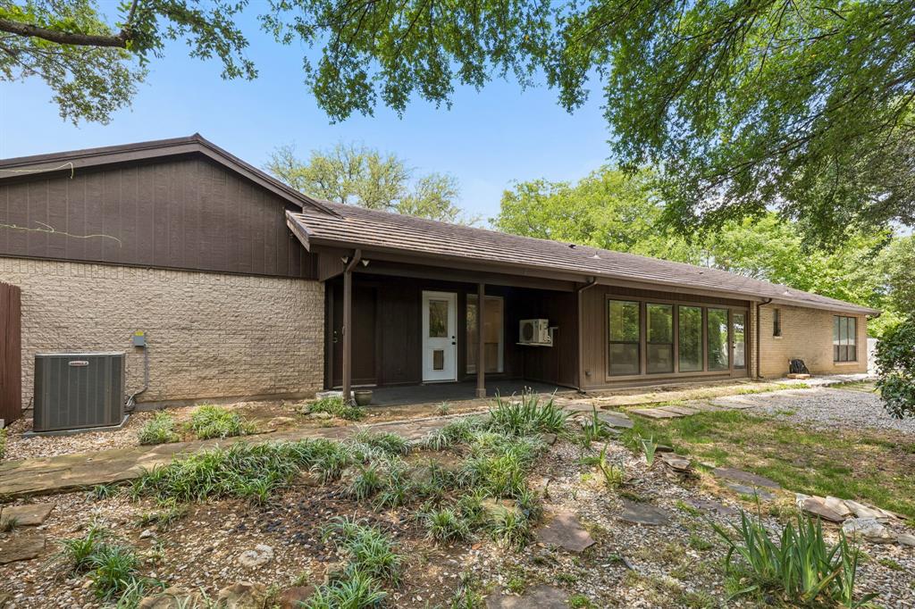 24 Legend Road Benbrook, TX 76132 - Photo 27 of 28 a house with trees in the background