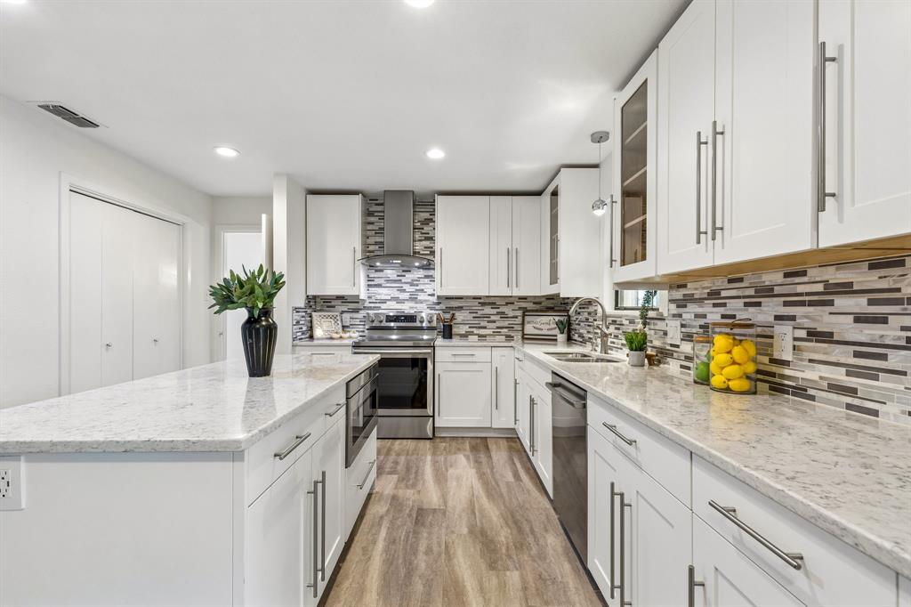 24 Legend Road Benbrook, TX 76132 - Photo 10 of 28 a kitchen with a sink a stove cabinets and counter space