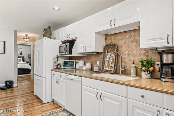 a kitchen with cabinets and window