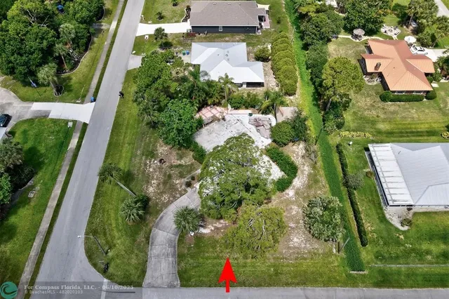 an aerial view of houses with yard