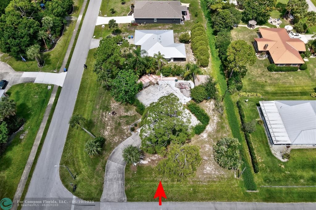 an aerial view of houses with yard