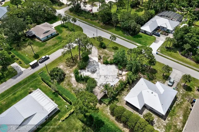 an aerial view of house with yard
