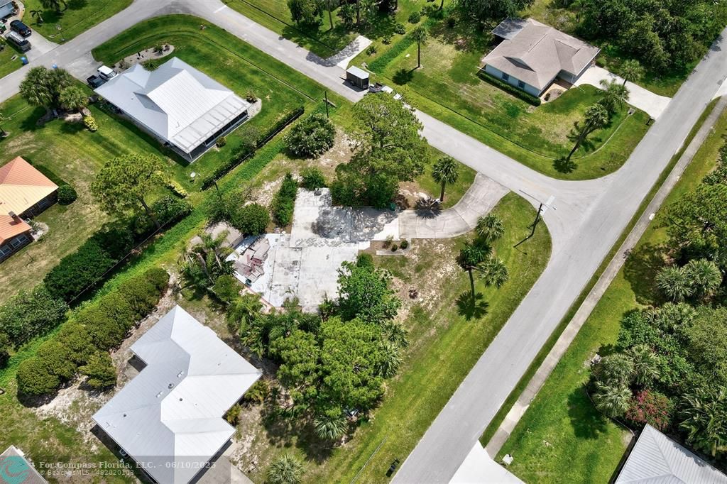 702 Lake Drive Sebastian, FL 32958 - Photo 9 of 14 an aerial view of a house with a garden