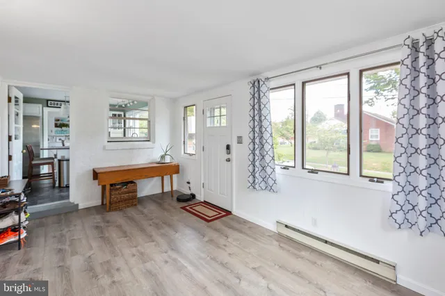 a room with wooden floor and furniture