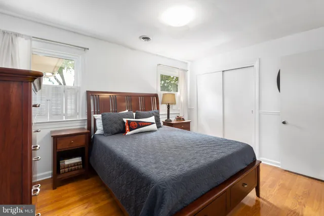 a bed room with a bed and a window