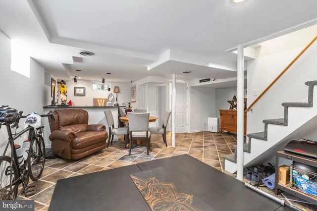 a living room with furniture and a rug