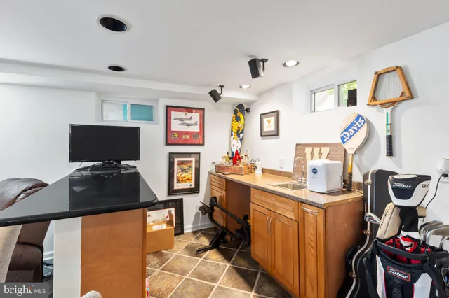 a workspace with furniture and mirror