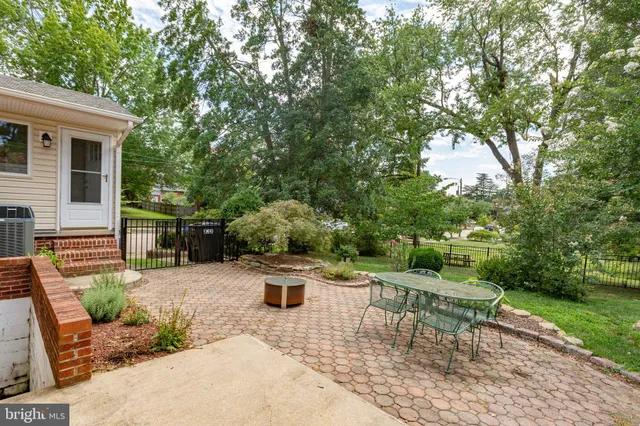 a view of backyard with a patio