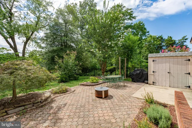 a view of a backyard with sitting area
