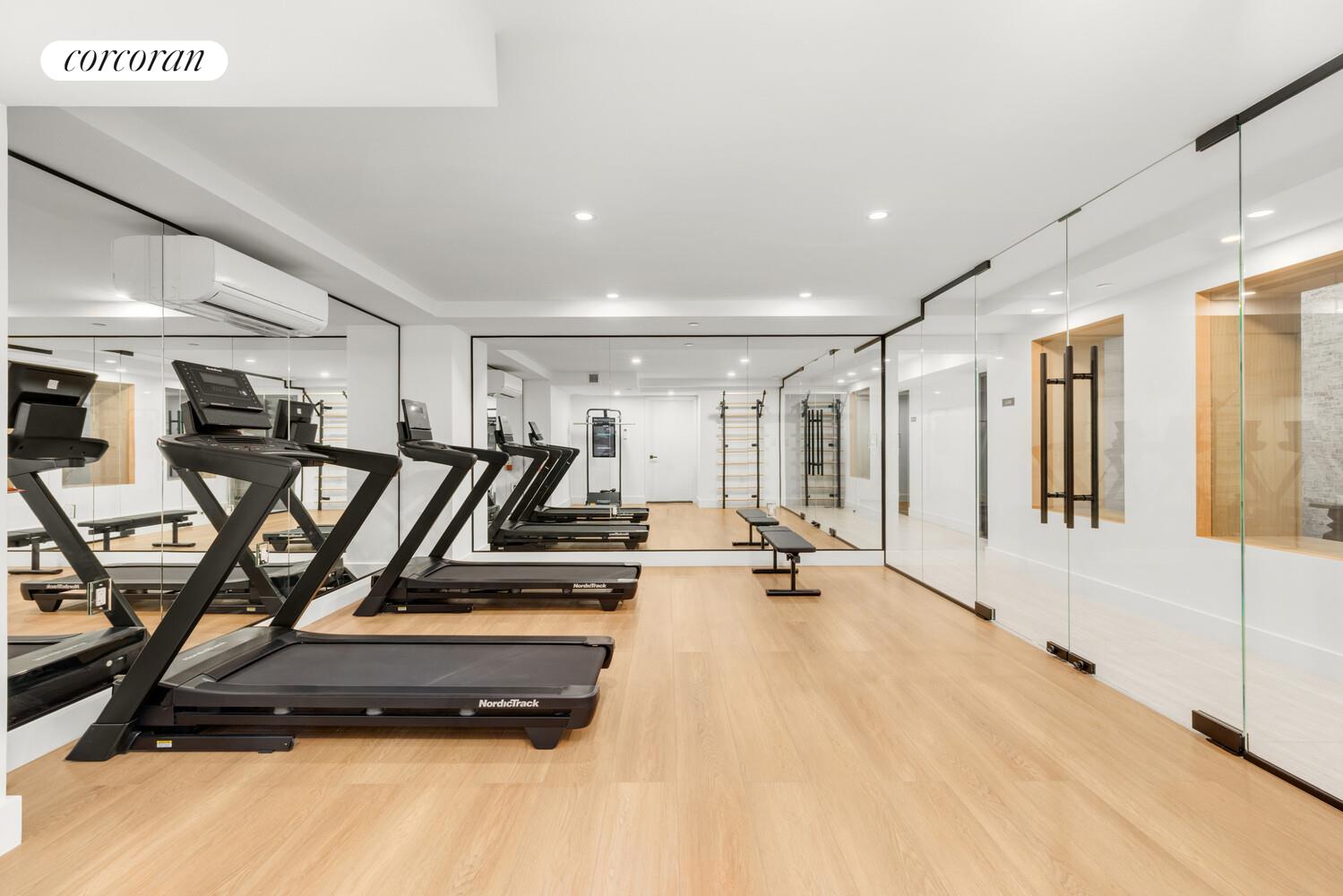 420 East 75th Street, Unit 2 Manhattan, NY 10021 - Photo 18 of 22 a view of a room with gym equipment