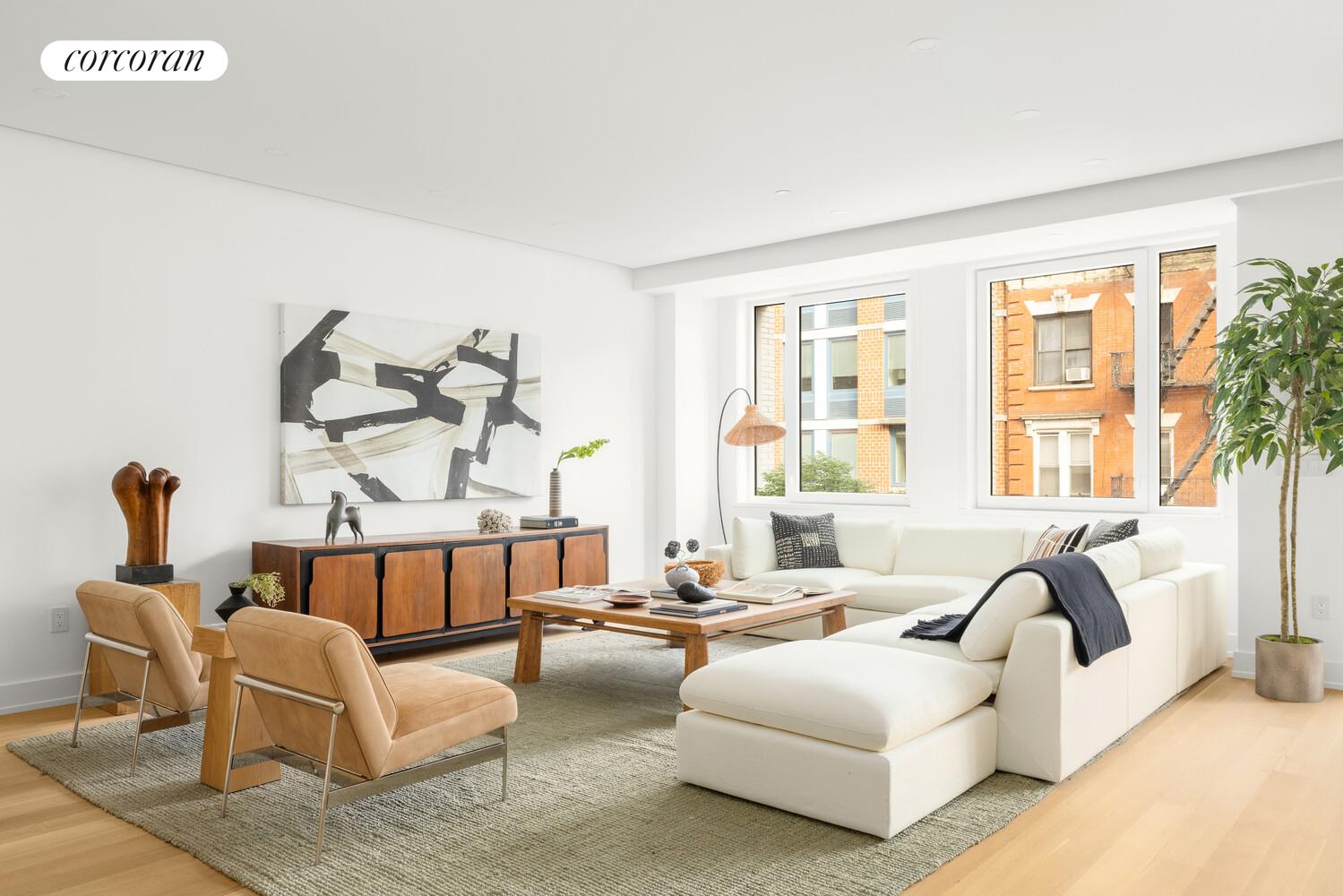 420 East 75th Street, Unit 2 Manhattan, NY 10021 - Photo 2 of 22 a living room with furniture and a large window