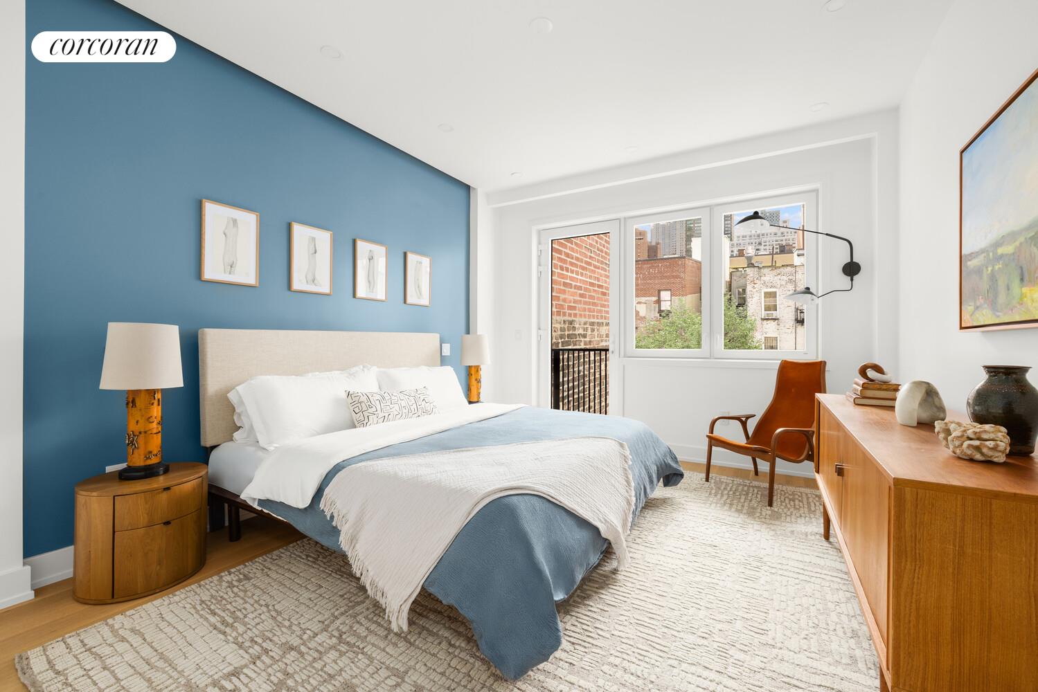 420 East 75th Street, Unit 2 Manhattan, NY 10021 - Photo 6 of 22 a bedroom with a bed and wooden floor