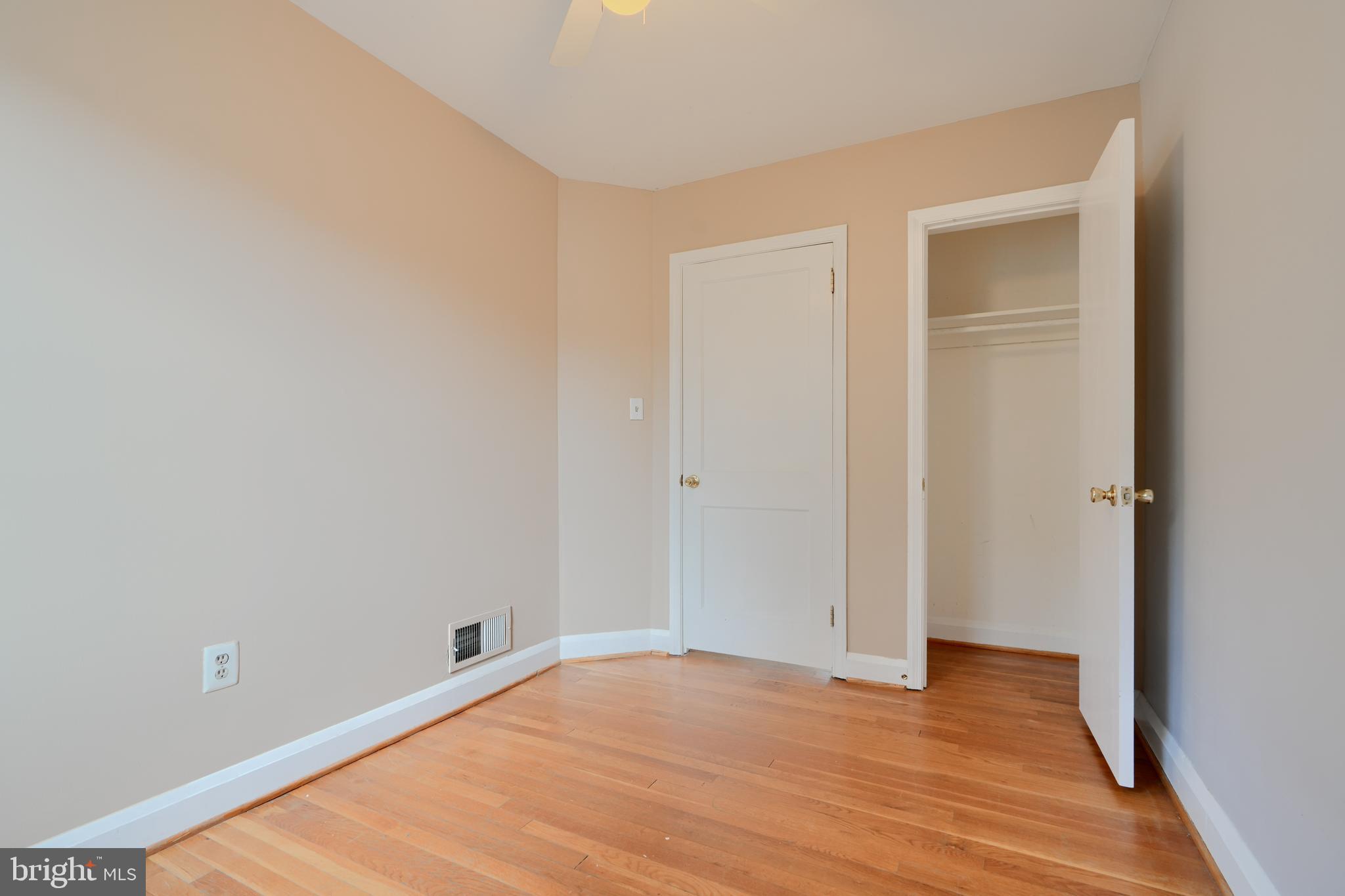 910 Radcliffe Road Towson, MD 21204 - Photo 17 of 32 a view of an empty room with wooden floor