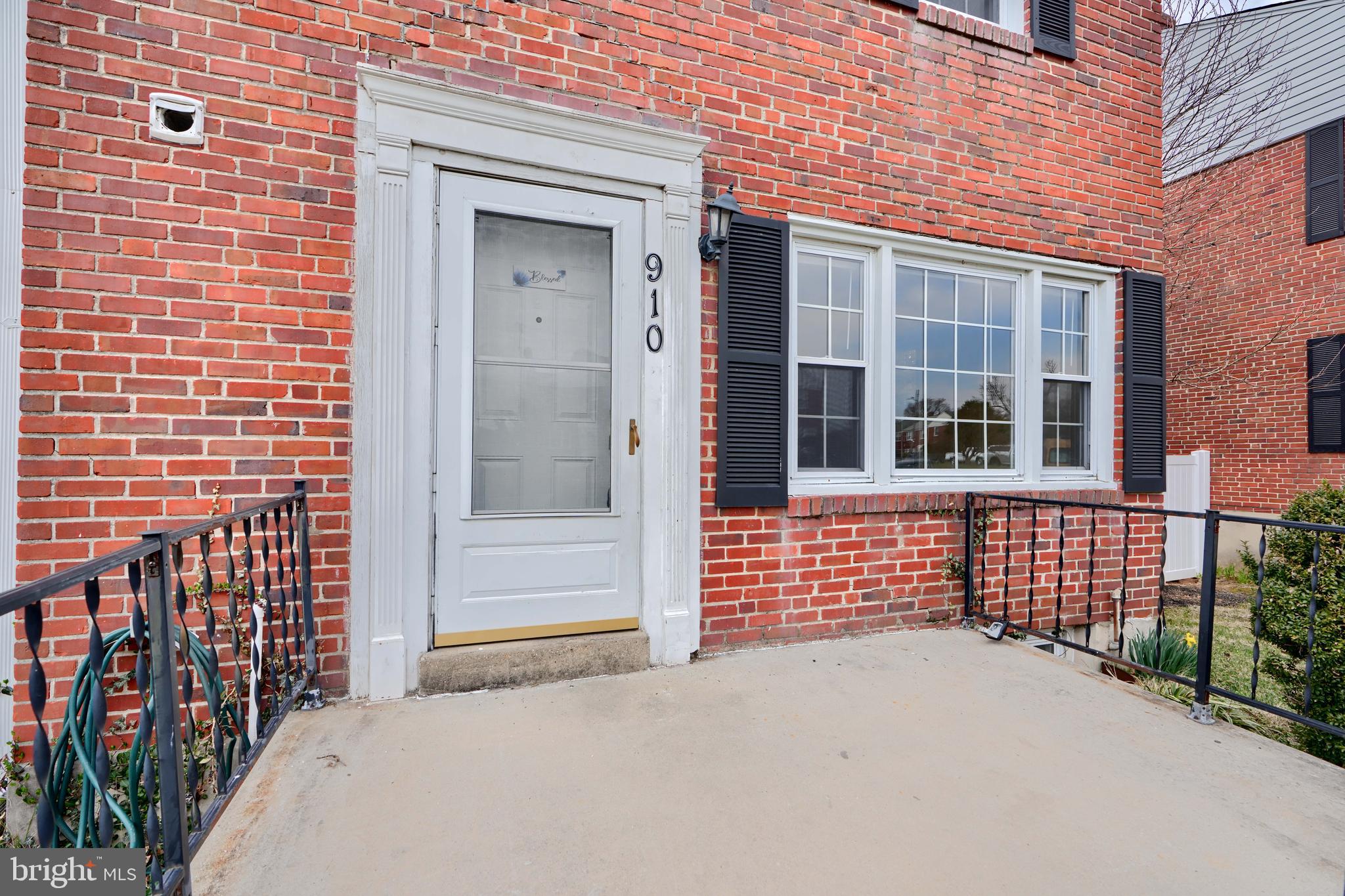 910 Radcliffe Road Towson, MD 21204 - Photo 2 of 32 a view of a brick house with many windows