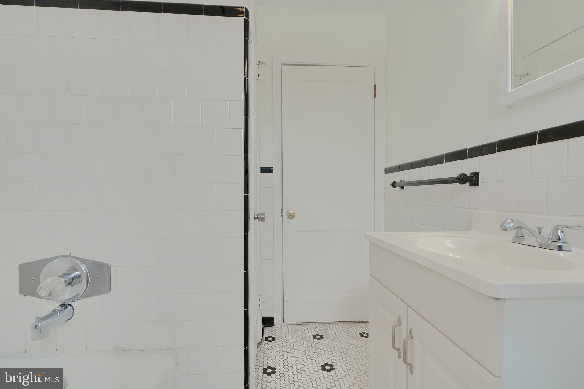 910 Radcliffe Road Towson, MD 21204 - Photo 24 of 32 a bathroom with a sink and vanity