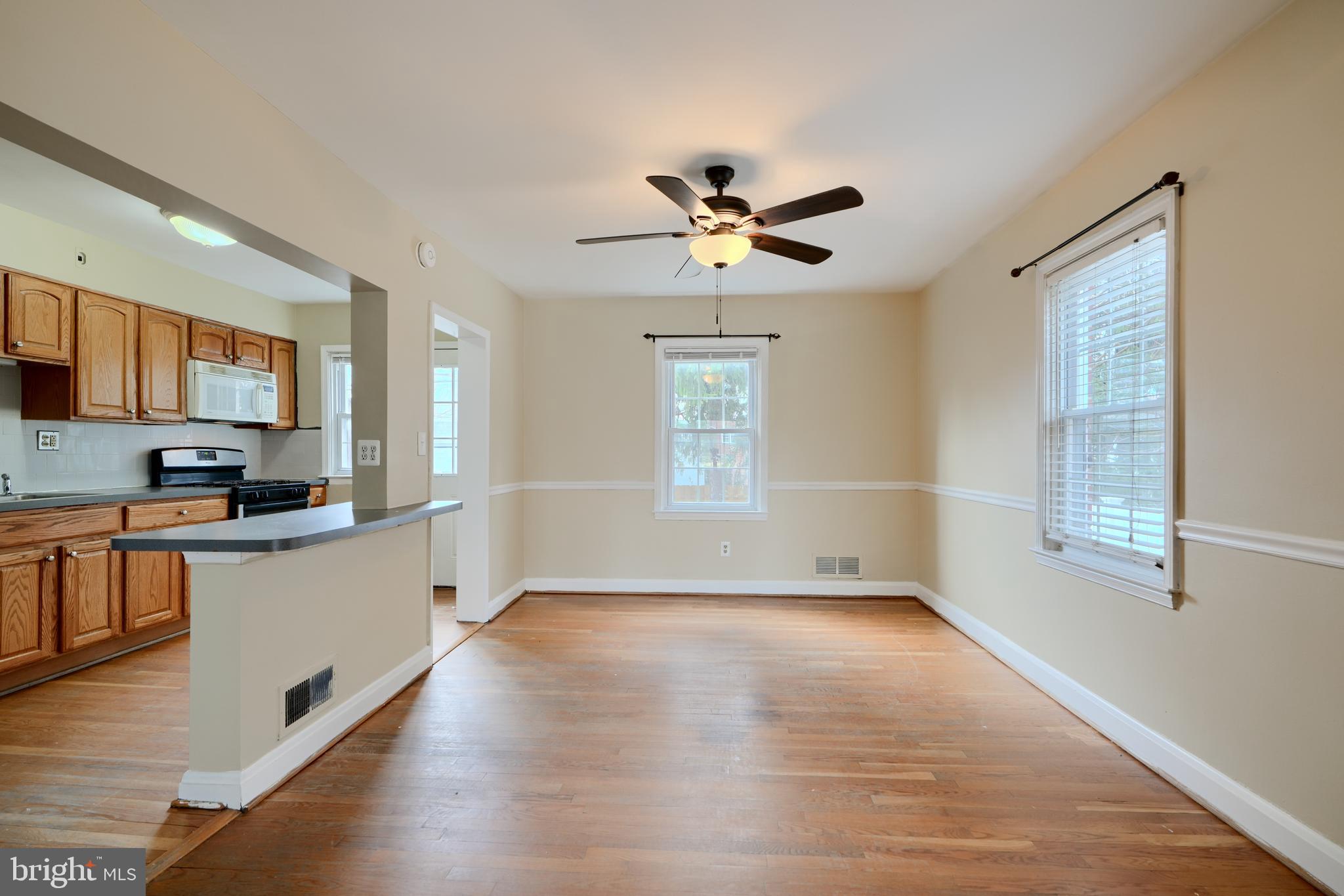 910 Radcliffe Road Towson, MD 21204 - Photo 6 of 32 a view of a kitchen with a sink wooden floor and a window
