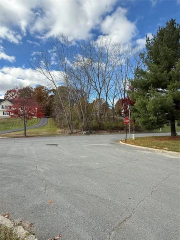 a view of a street with a fire pit and a barbeque