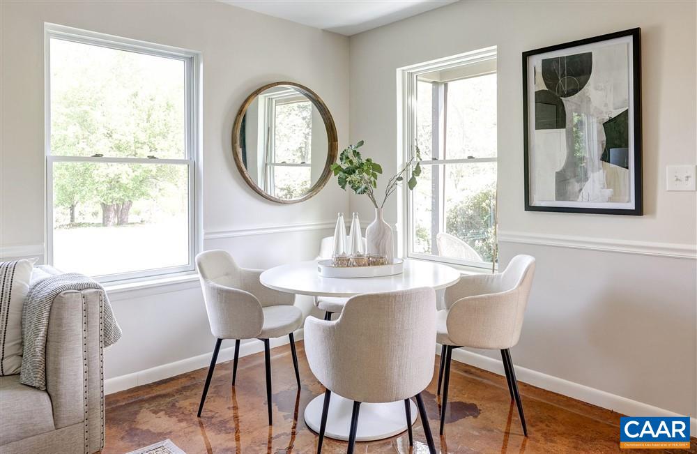 700 Merion Greene Charlottesville, VA 22901 - Photo 11 of 40 a view of a dining room with furniture window and wooden floor
