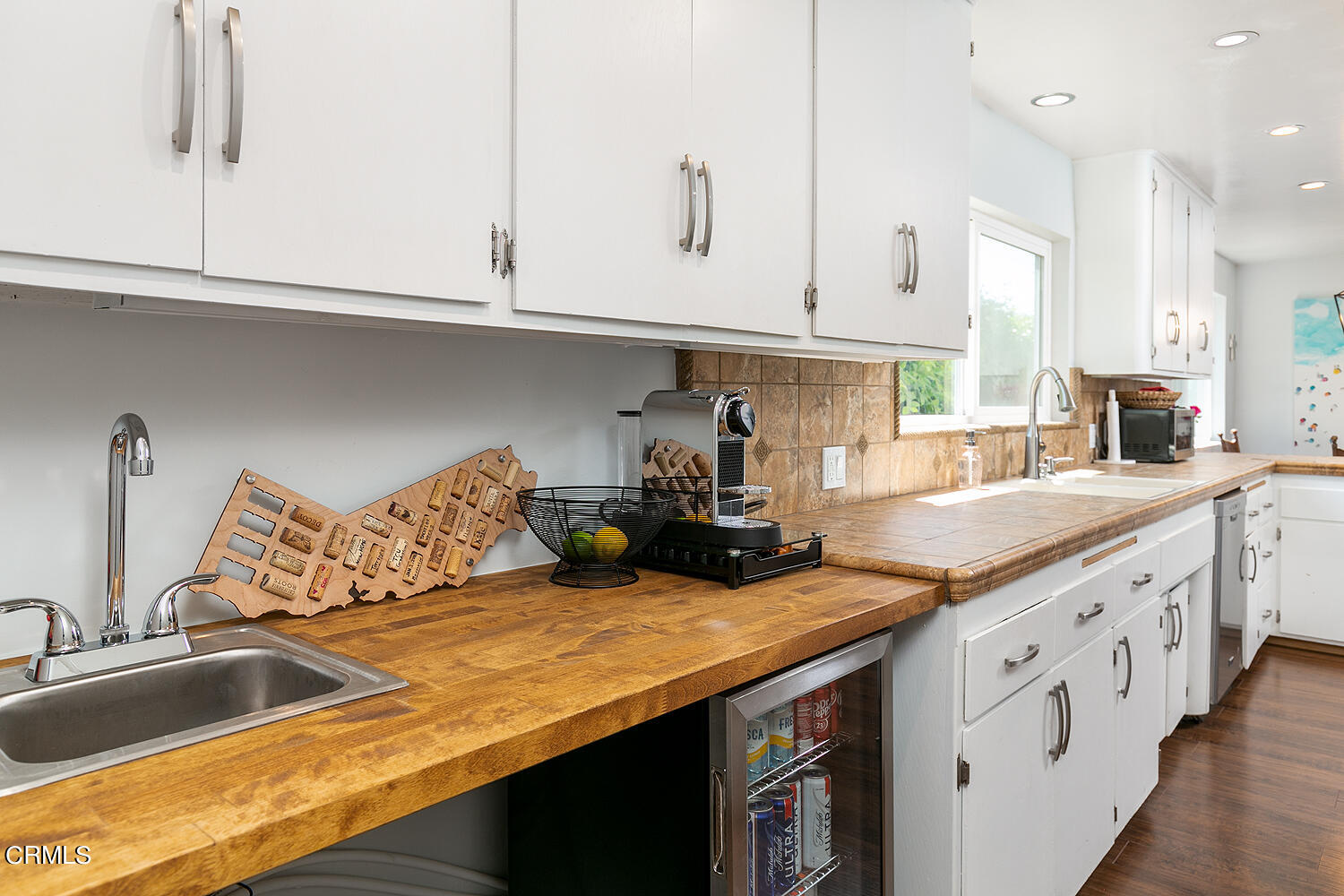 1035 West Roses Road San Gabriel, CA 91775 - Photo 12 of 28 a kitchen with granite countertop a sink a stove and cabinets