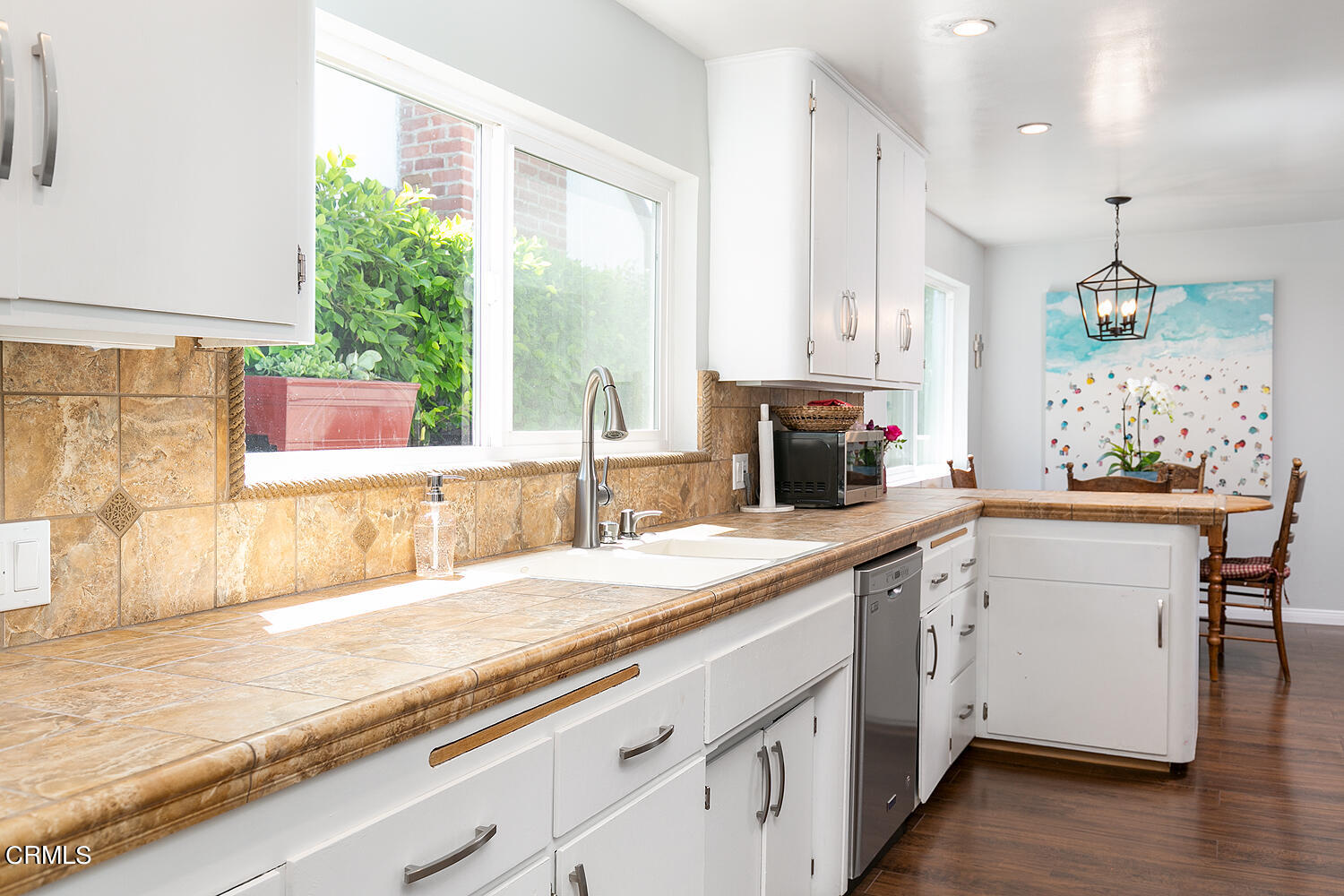 1035 West Roses Road San Gabriel, CA 91775 - Photo 13 of 28 a kitchen with a sink stove and cabinets