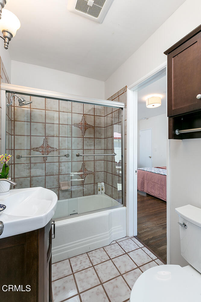 1035 West Roses Road San Gabriel, CA 91775 - Photo 17 of 28 a bathroom with a sink a toilet and shower