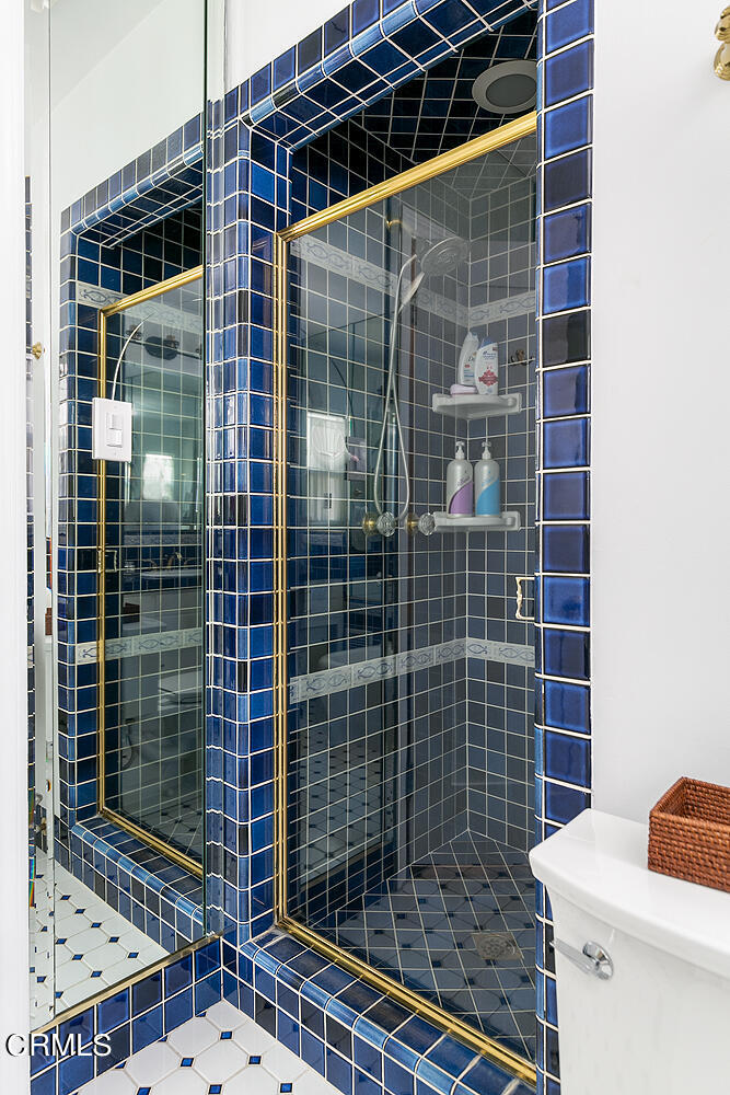 1035 West Roses Road San Gabriel, CA 91775 - Photo 22 of 28 a bathroom with a toilet and shower