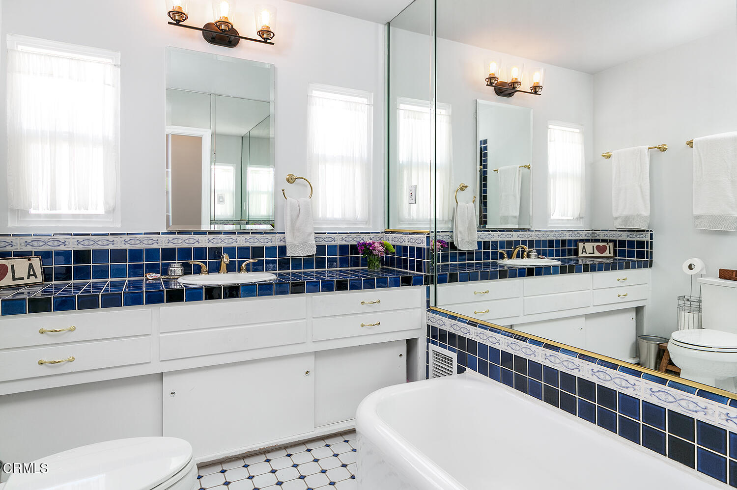1035 West Roses Road San Gabriel, CA 91775 - Photo 23 of 28 a bathroom with a sink and a mirror