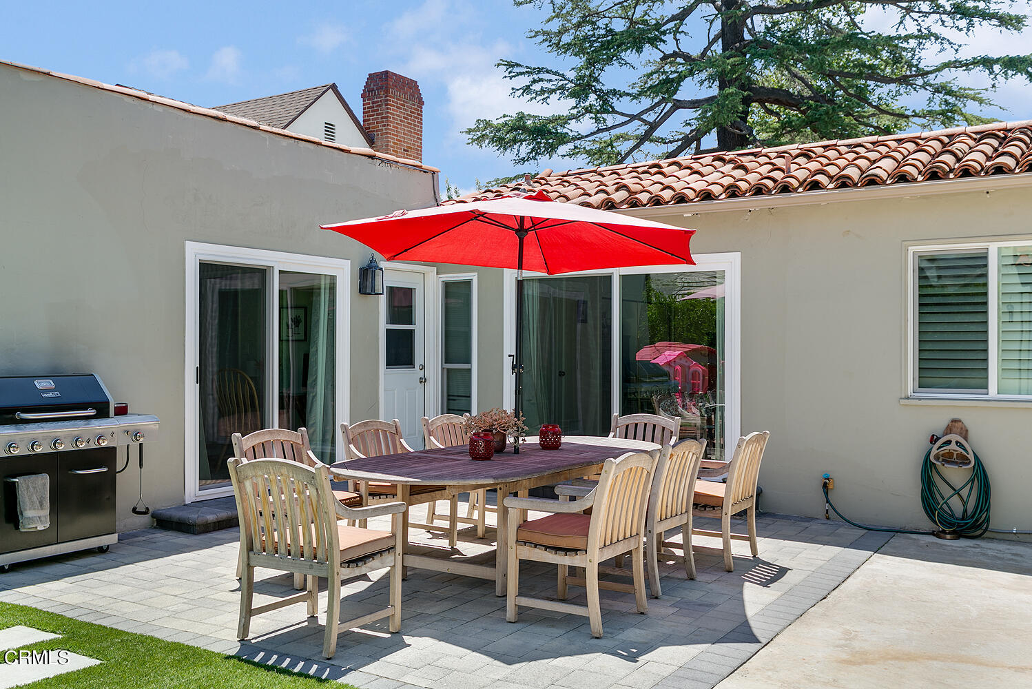 1035 West Roses Road San Gabriel, CA 91775 - Photo 24 of 28 a patio with a table and chairs under an umbrella