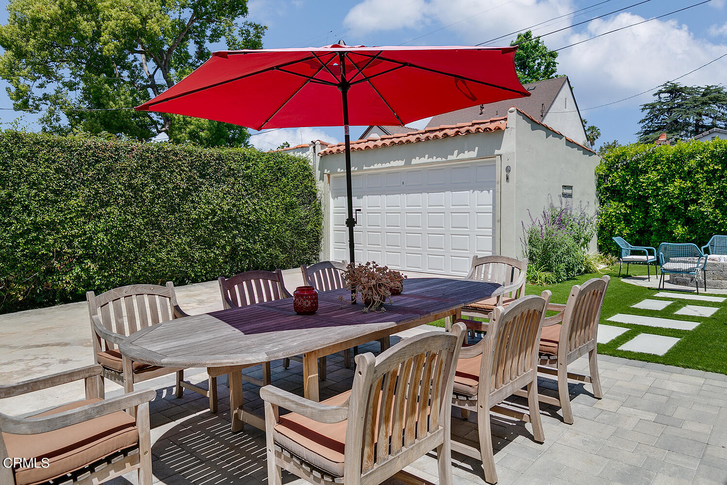 1035 West Roses Road San Gabriel, CA 91775 - Photo 25 of 28 a view of a table and chairs under an umbrella