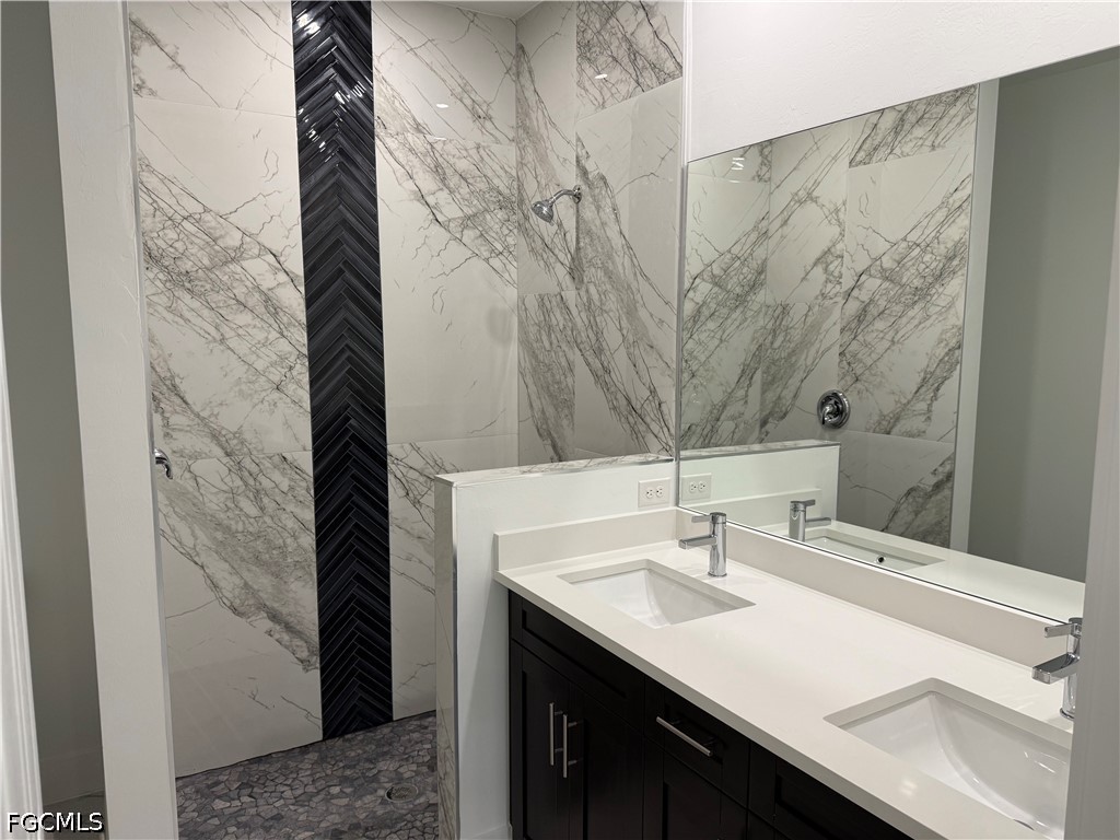 3203 24th Street Southwest Lehigh Acres, FL 33976 - Photo 5 of 19 a bathroom with a sink and a mirror