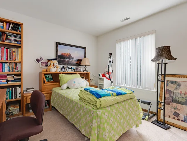 a bedroom with a bed furniture and a window