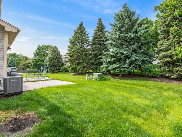a view of a swimming pool with a yard