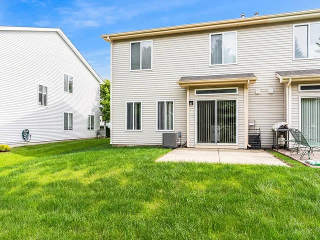 a front view of a house with a yard and porch