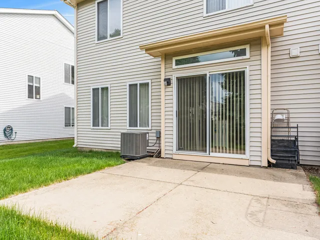 a view of a house with backyard and porch