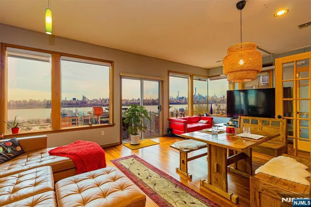 a very nice looking room with a large window and dining table