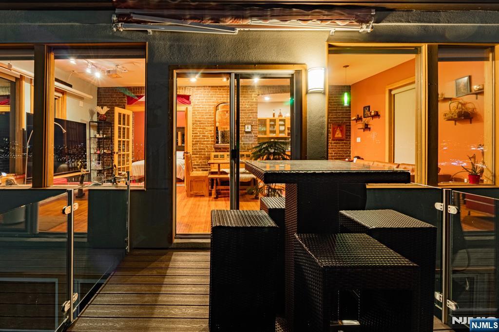 152 Pine Street Cliffside Park, NJ 07010 - Photo 15 of 15 a view of a balcony with furniture and large windows