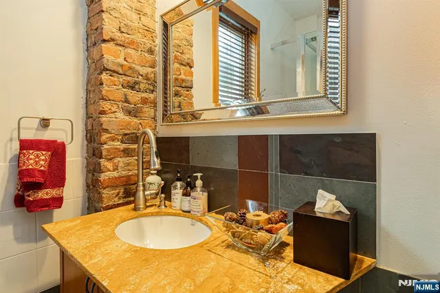 a bathroom with a sink and mirror