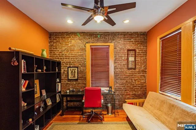 a balcony with furniture and a potted plant