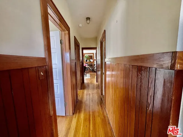 a view of gallery with wooden floor