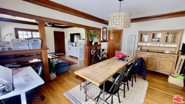 a view of a dining room with furniture window and wooden floor