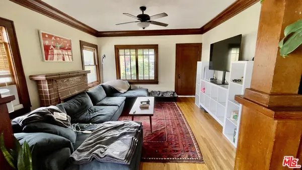 a living room with furniture and a rug