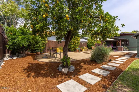 an aerial view of a house with yard swimming pool and outdoor seating