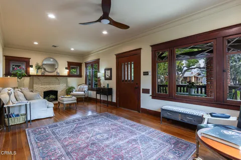 a view of a dining room with furniture wooden floor and chandelier