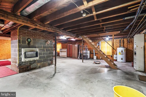 a view of a room with wooden ceiling